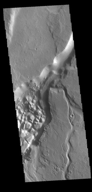 This VIS image shows part of Minio Vallis. Minio Vallis is just one of many channels that flow northward thru Terra Sirenum to empty into Amazonis Planitia. Minio Vallis is 88km long (55miles), and is located west of the much larger Mangala Valles.  Orbit Number: 79855 Latitude: -4.62787 Longitude: 208.183 Instrument: VIS Captured: 2019-12-15 13:52  https://photojournal.jpl.nasa.gov/catalog/PIA23734