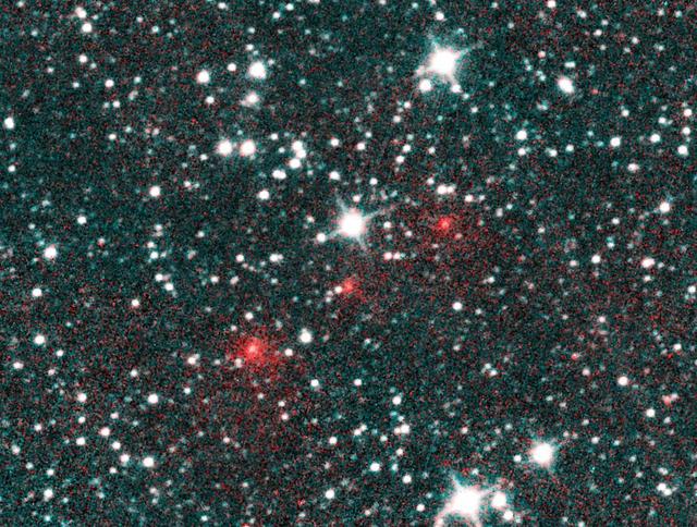 Comet C/2020 F3 NEOWISE appears as a string of fuzzy red dots in this composite of several heat-sensitive infrared images taken by NASA's Near-Earth Object Wide-field Infrared Survey Explorer (NEOWISE) mission on March 27, 2020. The comet was discovered using these images to track its motion across the sky against the backdrop of stationary stars and galaxies. These images have been processed such that cyan colors represent NEOWISE's 3.4-micron channel (a wavelength of light approximately seven times longer than the green light that humans see), and red colors represent the NEOWISE 4.6-micron channel. The comet's extended halo, or coma, of gas and dust was already apparent in the discovery images. The comet appears much redder than the background stars and galaxies because it is much cooler and therefore emits more light at longer wavelengths.  https://photojournal.jpl.nasa.gov/catalog/PIA23792