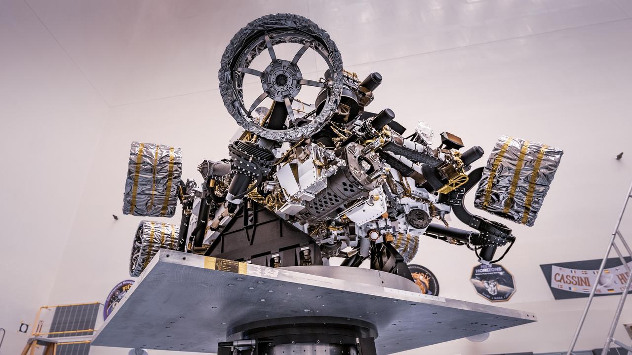NASA's Perseverance rover can be seen attached to a spin table during a test of its mass properties at the Kennedy Space Center in Florida. During the test, the rover was rotated clockwise and counterclockwise to determine its center of gravity, or the point at which weight is evenly dispersed on all sides. The image was taken on April 7, 2020.  https://photojournal.jpl.nasa.gov/catalog/PIA23826