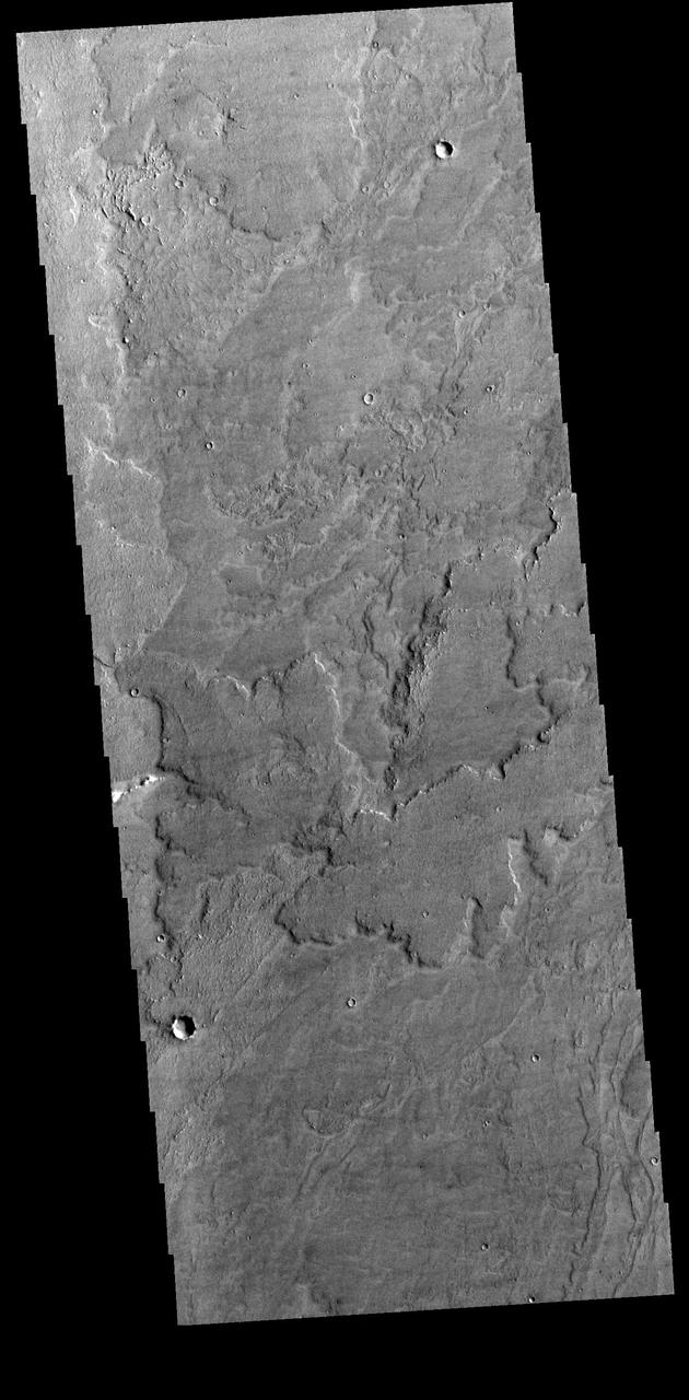 Today's VIS image shows a small portion of Daedalia Planum. Daedalia Planum is an immense lava flow field that originates at Arsia Mons. Arsia Mons is the southernmost of the three large aligned volcanoes in the Tharsis region. Arsia Mons' last eruption was 10s of million years ago. Orbit Number: 80553 Latitude: -23.7847 Longitude: 234.227 Instrument: VIS Captured: 2020-02-11 01:06 https://photojournal.jpl.nasa.gov/catalog/PIA23840
