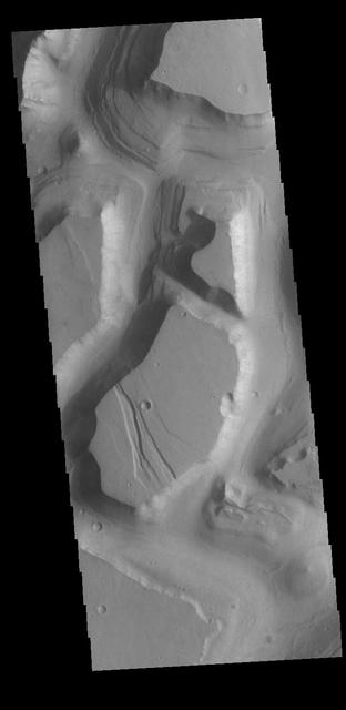 This VIS image shows part of Hydraotes Chaos. Hydraotes Chaos measures about 300 kilometers (190 miles) wide by roughly 350 km (220 mi) north-south, and it lies in a valley leading northeast out of Ganges Chasma at the east end of Valles Marineris. Tiu Valles flows northward from Hydraotes Chaos to empty into Chryse Planitia. Orbit Number: 80949 Latitude: 1.53809 Longitude: 326.515 Instrument: VIS Captured: 2020-03-14 15:48 https://photojournal.jpl.nasa.gov/catalog/PIA23906