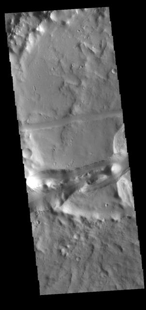 This VIS image shows part of the Memnonia Fossae graben. Memnonia Fossae, Mangala Fossae and Sirenum Fossae are all long graben (tectonic troughs) systems that stretch from eastern Terra Sirenum into western Daedalia Planum. Orbit Number: 80629 Latitude: -21.8719 Longitude: 201.417 Instrument: VIS Captured: 2020-02-17 07:18 https://photojournal.jpl.nasa.gov/catalog/PIA23909