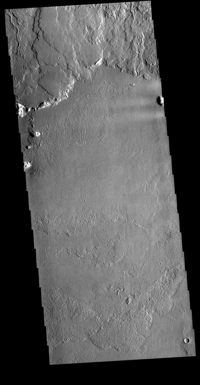 This VIS image shows the region where flank flows from Olympus Mons (top of image) meet the surrounding lava plains.  Orbit Number: 80678 Latitude: 12.5468 Longitude: 223.171 Instrument: VIS Captured: 2020-02-21 08:19  https://photojournal.jpl.nasa.gov/catalog/PIA23910