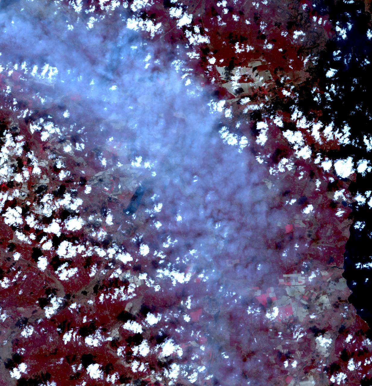 Fires began near the Chernobyl Nuclear Power Plant in Ukraine April 4, 2020. By April 14, the fires were nearly extinguished. On April 16, new fires erupted, sending large, dark gray clouds of smoke traveling over 750 km to the southeast. The ASTER image, acquired April 18, shows part of the billowing smoke plume. The image covers an area of 59.2 by 61.4 km, and is located near 51 degrees north, 30.1 degrees east.  https://photojournal.jpl.nasa.gov/catalog/PIA23911