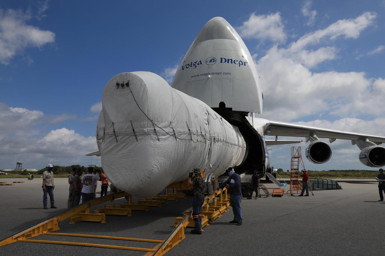 The first stage of the United Launch Alliance Atlas V that will carry NASA's Perseverance rover into space is offloaded from an Antonov cargo plane at Kennedy Space Center in Florida on May 11, 2020. https://photojournal.jpl.nasa.gov/catalog/PIA23917