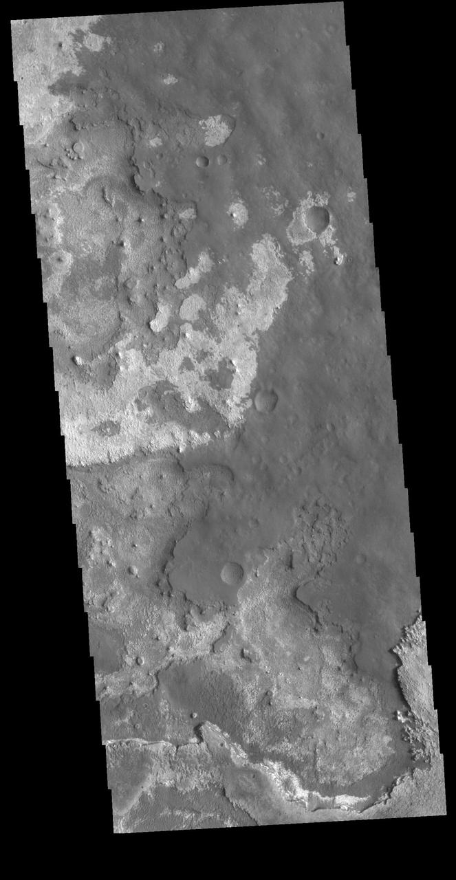 This VIS image shows layering of surface materials in Meridiani Planum. TES (Thermal Emission Spectrometer) initially detected hematite in a surface layer, which was confimed by THEMIS (THrmal EMision Imaging System). These findings supported a water rich origin of the hematite and led to the selection of the site for the Opportunity MER (Mars Exploration Rover). Orbit Number: 80848 Latitude: 1.85739 Longitude: 0.251223 Instrument: VIS Captured: 2020-03-06 08:13 https://photojournal.jpl.nasa.gov/catalog/PIA23930