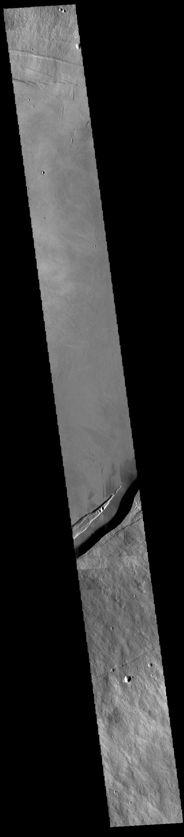 This VIS image shows part of the summit caldera on Arsia Mons.  Orbit Number: 80977 Latitude: -9.5156 Longitude: 240.199 Instrument: VIS Captured: 2020-03-16 23:04  https://photojournal.jpl.nasa.gov/catalog/PIA23932