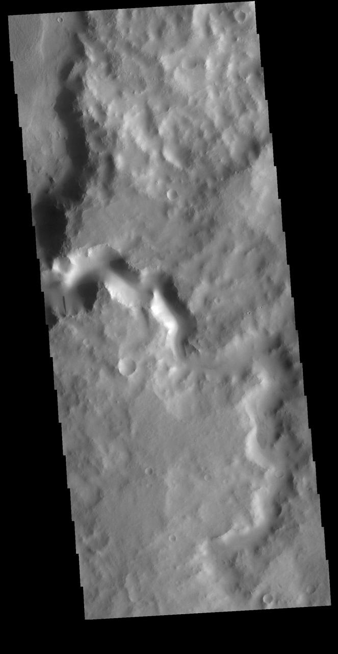Today's VIS image shows an unnamed channel in Terra Sabaea. The channel is flowing into the crater just visible in the upper left portion of the image.  Orbit Number: 81221 Latitude: 6.14616 Longitude: 38.9585 Instrument: VIS Captured: 2020-04-06 01:20  https://photojournal.jpl.nasa.gov/catalog/PIA23946