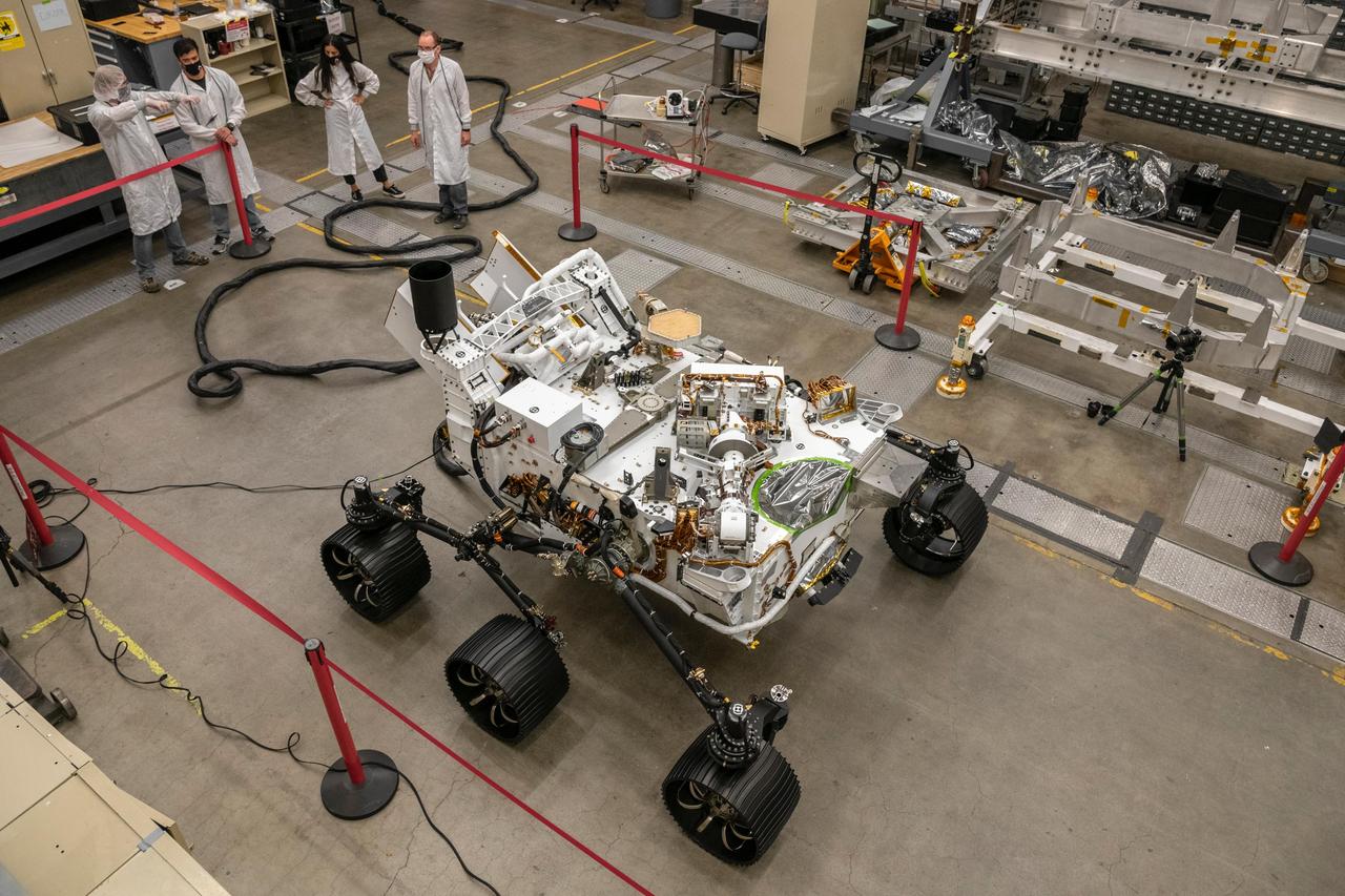 Engineers test drive the Earth-bound twin of NASA's Perseverance Mars rover for the first time in a warehouselike assembly room at the agency's Jet Propulsion Laboratory in Southern California on Sept. 1, 2020. This full-scale engineering version of Perseverance helps the mission team gauge how hardware and software will perform before they transmit commands to the real rover on Mars. This vehicle system test bed (VSTB) rover is also known as OPTIMISM (Operational Perseverance Twin for Integration of Mechanisms and Instruments Sent to Mars).  The Mars 2020 Perseverance astrobiology mission is part of America's larger Moon to Mars exploration approach that includes missions to the Moon as a way to prepare for human exploration of the Red Planet. Charged with sending the first woman and next man to the Moon by 2024, NASA will establish a sustained human presence on and around the Moon by 2028 through NASA's Artemis program.  https://photojournal.jpl.nasa.gov/catalog/PIA23964