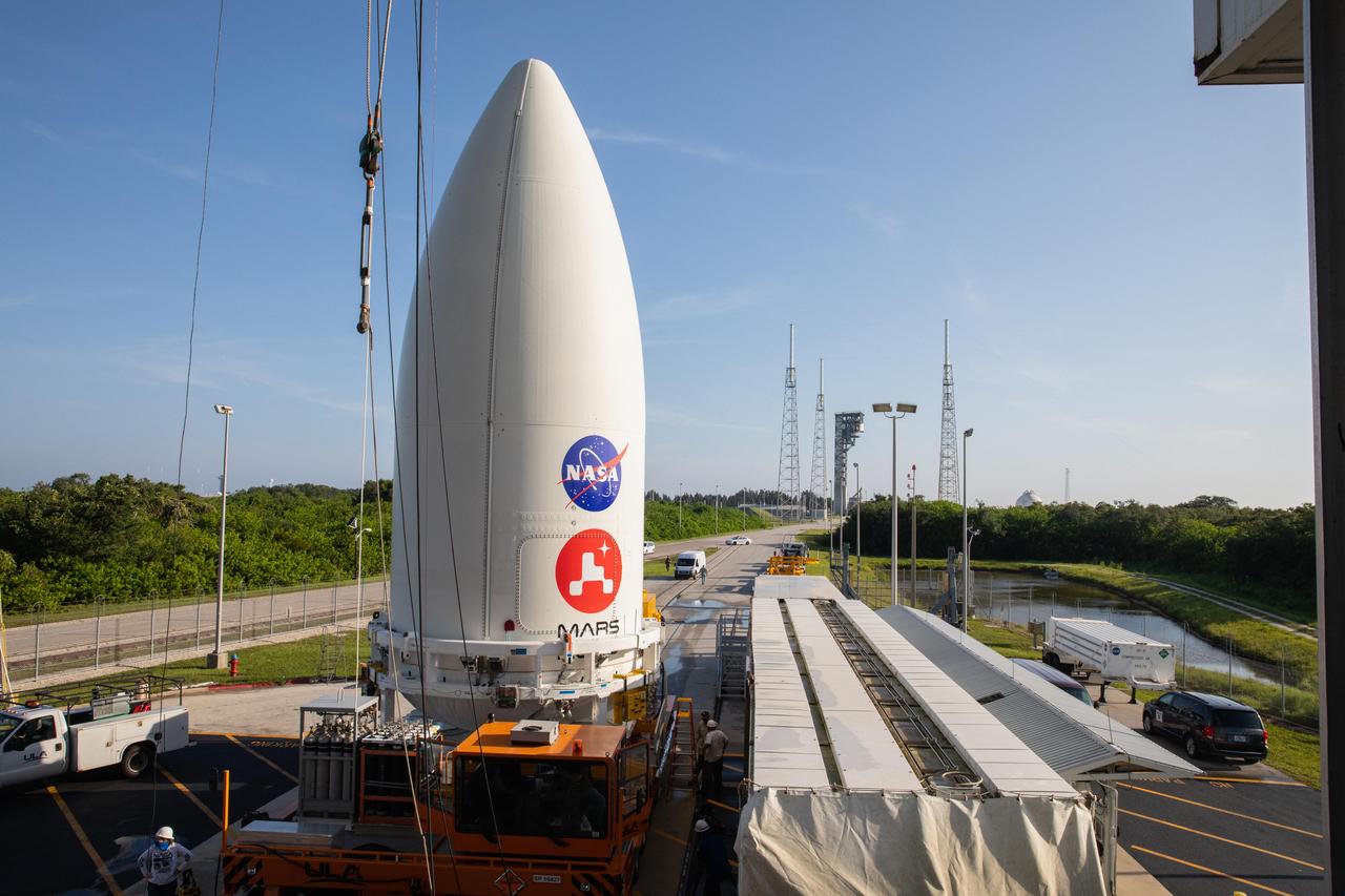 The payload fairing, or nose cone, containing the Mars 2020 Perseverance rover sits atop the motorized payload transporter that will carry it to Space Launch Complex 41 on Cape Canaveral Air Force Station in Florida. The image was taken on July 7, 2020.  https://photojournal.jpl.nasa.gov/catalog/PIA23985