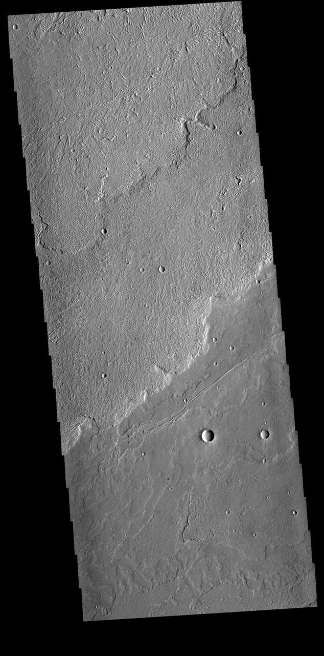 Today's VIS image shows a small portion of the immense lava flows that originated from Arsia Mons. Arsia Mons is the southernmost of the three large aligned volcanoes in the Tharsis region. Arsia Mons' last eruption was 10s of million years ago. The different surface textures are created by differences in the lava viscosity and cooling rates. The lobate margins of each flow can be traced back to the start of each flow — or to the point where they are covered by younger flows. Flows in Daedalia Planum can be as long as 180 km.  Orbit Number: 81539 Latitude: -20.6524 Longitude: 228.51 Instrument: VIS Captured: 2020-05-02 05:36  https://photojournal.jpl.nasa.gov/catalog/PIA23993