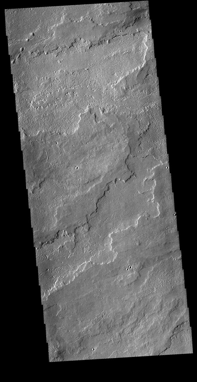 Today's VIS image shows a portion of the immense volcanic flow fields in the Tharsis region. These flows are northeast of Ascraeus Mons. Orbit Number: 81575 Latitude: 16.1457 Longitude: 264.928 Instrument: VIS Captured: 2020-05-05 04:57 https://photojournal.jpl.nasa.gov/catalog/PIA24001
