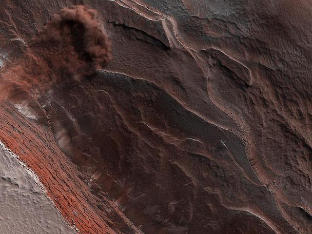 The High-Resolution Imaging Science Experiment (Hi-RISE) camera aboard NASA's Mars Reconnaissance Orbiter captured this avalanche plunging down a 1,640-foot-tall (500-meter-tall) cliff on May 29, 2019. The image also reveals layers at Mars' north pole during spring. As temperatures increase and vaporize ice, the destabilized ice blocks break loose and kick up dust.  https://photojournal.jpl.nasa.gov/catalog/PIA24035