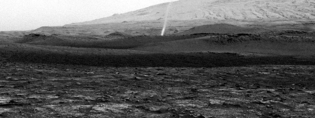 NASA's Curiosity Mars rover spotted this dust devil with one of its Navigation Cameras around 11:35 a.m. local Mars time on Aug. 9, 2020 (the 2,847th Martian day, or sol, of the mission). The frames in this GIF were shot over 4 minutes and 15 seconds.  Taken from the "Mary Anning" drill site, this dust devil appears to be passing through small hills just above Curiosity's present location on Mount Sharp. The dust devil is approximately one-third to a half-mile (half-a-kilometer to a kilometer) away and estimated to be about 16 feet (5 meters) wide. The dust plume disappears past the top of the frame, so an exact height can't be known, but it's estimated to be at least 164 feet (50 meters) tall.  Contrast has been modified to make frame-to-frame changes easier to see.  Movie available at https://photojournal.jpl.nasa.gov/catalog/PIA24039