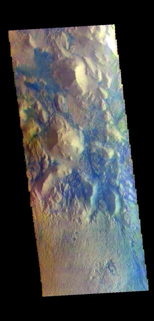 The THEMIS VIS camera contains 5 filters. The data from different filters can be combined in multiple ways to create a false color image. These false color images may reveal subtle variations of the surface not easily identified in a single band image. Today's false color image shows part of the region between Terra Cimmeria and Aeolis Planum. The bottom half of the image is a surface that has been etched by wind action. To form the fine scale grooves, the surface material must be easy to erode. In the hills at the top of the image the same fine scale groove features don't exist. In this region the hills are partially surrounded by material that is blue in this false color combination. Dark blue is interpreted to be basaltic sand. It is possible that the sand in the top of the image was scoured from the surface in the bottom of the image.  Orbit Number: 68393 Latitude: -7.61871 Longitude: 150.994 Instrument: VIS Captured: 2017-05-15 11:31  https://photojournal.jpl.nasa.gov/catalog/PIA24077