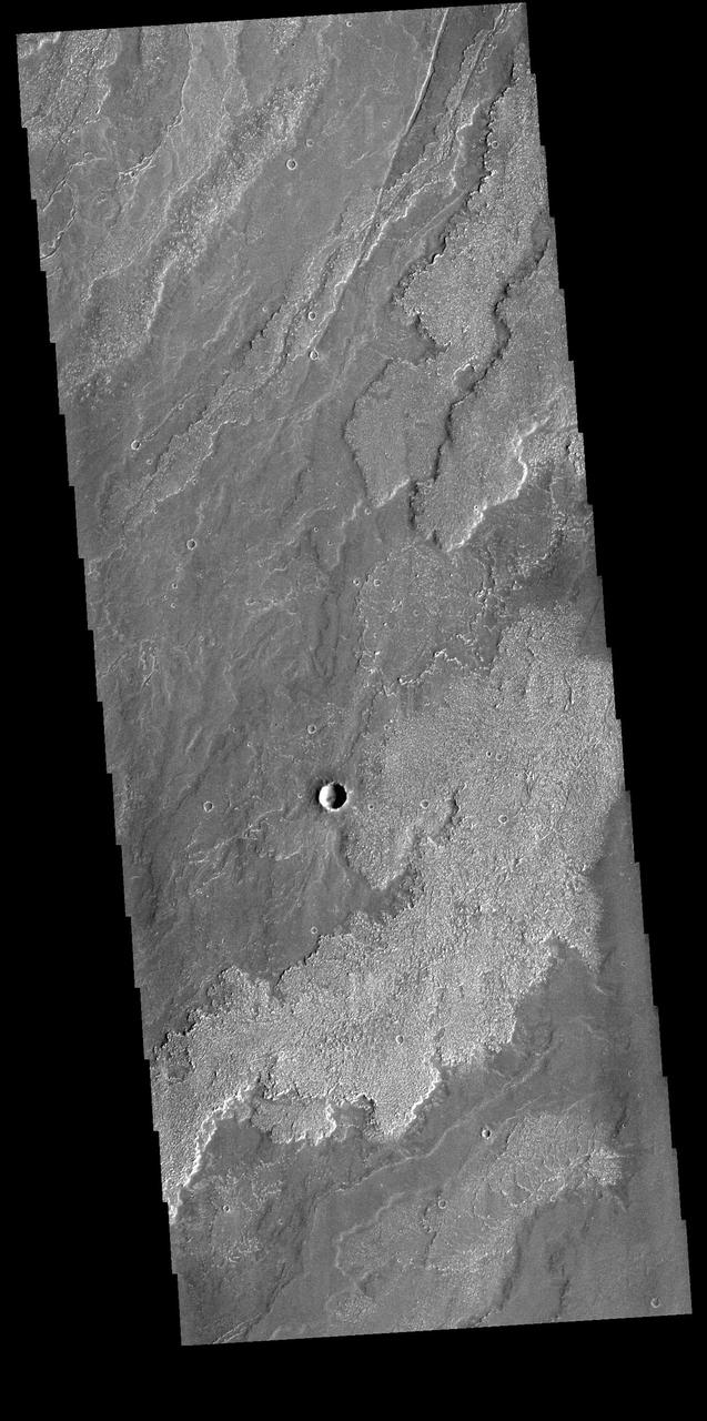 Today's VIS image shows a small portion of the immense lava flows that originated from Arsia Mons. Arsia Mons is the southernmost of the three large aligned volcanoes in the Tharsis region. Arsia Mons' last eruption was 10s of million years ago. The different surface textures are created by differences in the lava viscosity and cooling rates. The lobate margins of each flow can be traced back to the start of each flow -- or to the point where they are covered by younger flows. Flows in Daedalia Planum can be as long as 180 km.  Orbit Number: 81913 Latitude: -22.2957 Longitude: 239.093 Instrument: VIS Captured: 2020-06-02 00:40  https://photojournal.jpl.nasa.gov/catalog/PIA24090