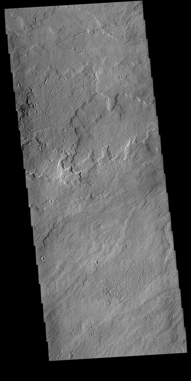 Today's VIS image shows a small part of Daedalia Planum. The lava flows originate from Arsia Mons, one of the large volcanoes in the Tharsis region. The different surface textures are created by differences in the lava viscosity and cooling rates. The lobate margins of each flow can be traced back to the start of each flow — or to the point where they are covered by younger flows. Flows in Daedalia Planum can be as long as 180 km. Orbit Number: 82038 Latitude: -14.622 Longitude: 231.902 Instrument: VIS Captured: 2020-06-12 07:44 https://photojournal.jpl.nasa.gov/catalog/PIA24115