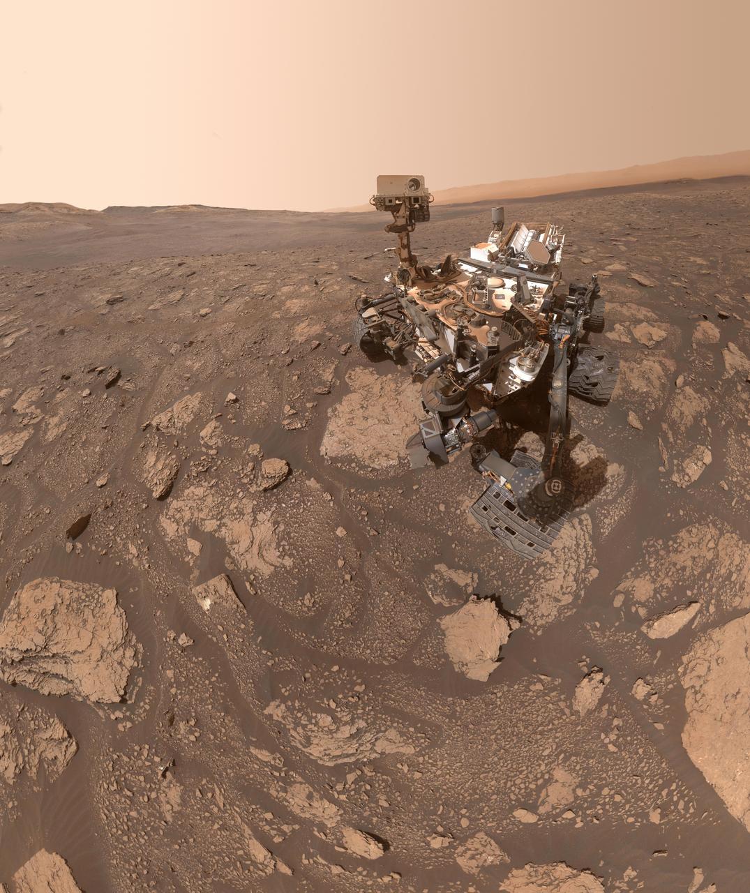 NASA's Curiosity Mars rover took this selfie at a location nicknamed "Mary Anning" after a 19th century English paleontologist. Curiosity snagged three samples of drilled rock at this site on its way out of the Glen Torridon region, which scientists believe was a site where ancient conditions would have been favorable to supporting life, if it ever was present.  Curiosity took the selfie using a camera called the Mars Hand Lens Imager located on the end of its robotic arm (videos explaining how Curiosity's selfies are taken can be found here). A close-up detail from within the selfie shows the three holes that a rock drill, also found on the end of Curiosity's arm, added to the surface. The three drill holes are named "Mary Anning," "Mary Anning 3" and "Groken," the last name coming from a site of geological interest in the Scottish countryside.  https://photojournal.jpl.nasa.gov/catalog/PIA24173