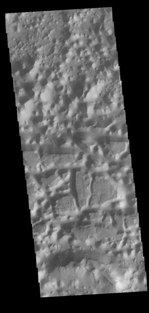 Chaos terrain is typified by regions of blocky, often steep sided, mesas interspersed with deep valleys. With time and erosion the valleys widen and the mesas become smaller. In this region south of Eos Chasma there are regions where the mesas have eroded down into small hills (top of the image), as well as large, steep sided mesas (center to bottom of the image). Orbit Number: 82921 Latitude: -16.8648 Longitude: 318.197 Instrument: VIS Captured: 2020-08-24 00:40 https://photojournal.jpl.nasa.gov/catalog/PIA24186