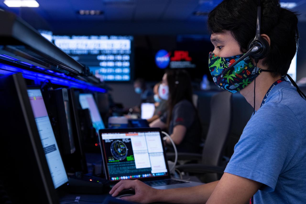Attitude Control Systems lead Chris Pong donned a dinosaur-themed mask for his participation in the Mars 2020 mission's second trajectory correction maneuver at NASA's Jet Propulsion Laboratory in Southern California. The navigation team successfully sent commands to the spacecraft to adjust its flight path during its long cruise to Mars.  https://photojournal.jpl.nasa.gov/catalog/PIA24191