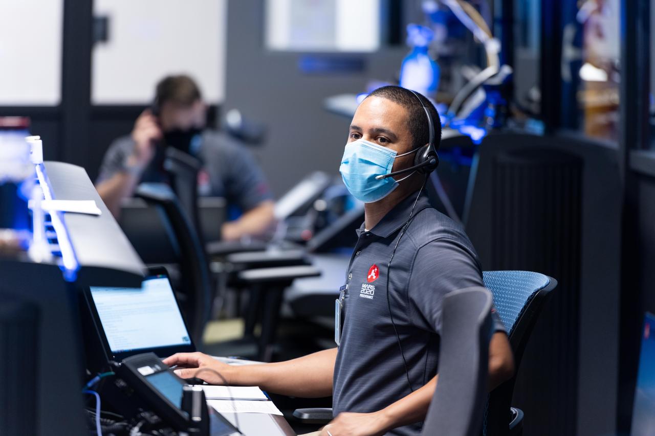 Matt Smith, flight director for the second Mars 2020 mission trajectory correction maneuver (TCM-2), studying the screens at NASA's Jet Propulsion Laboratory in Southern California. TCMs are a series of planned adjustments to put the rover on the correct path to land on Mars. https://photojournal.jpl.nasa.gov/catalog/PIA24193
