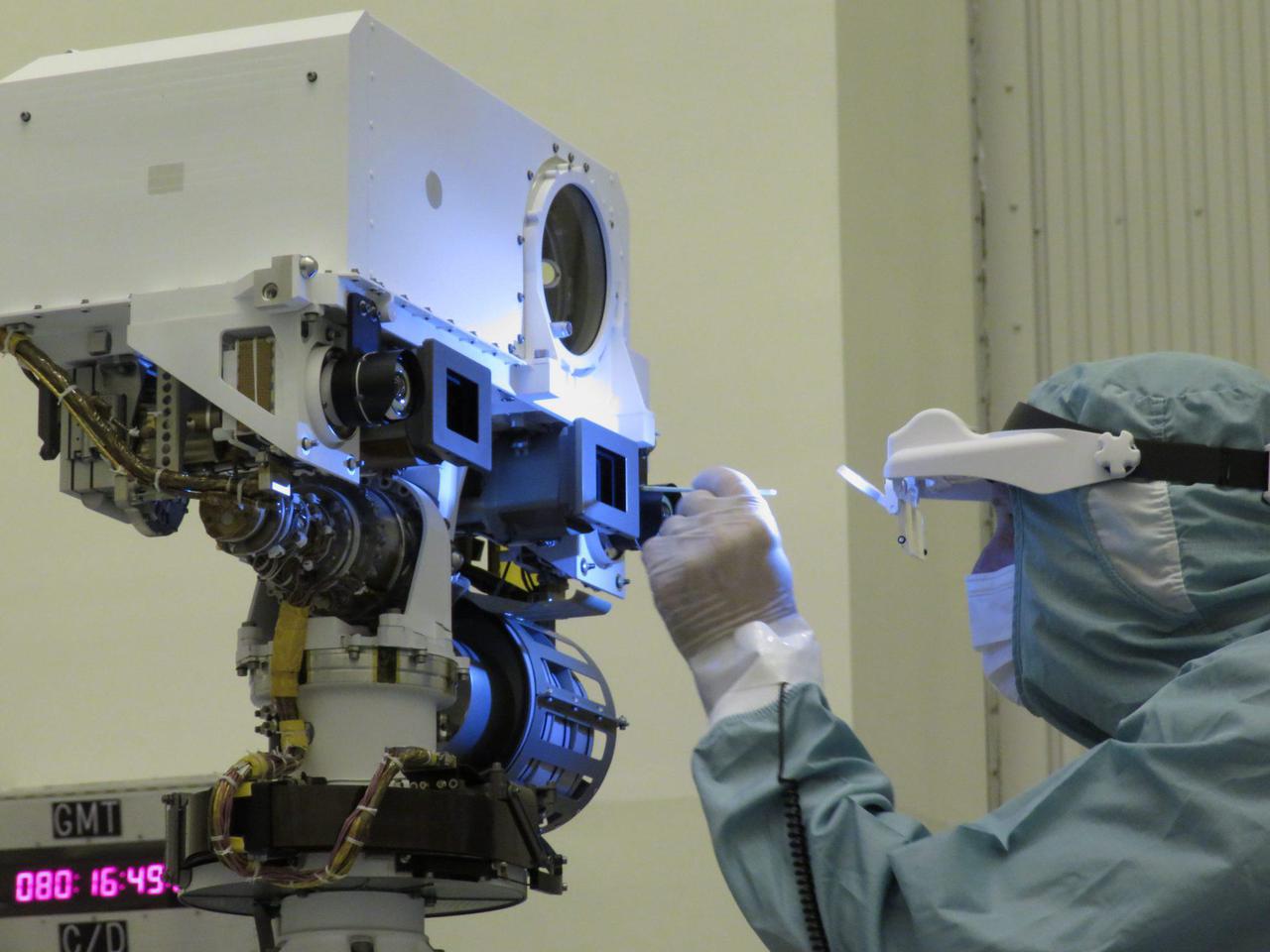 A JPL optical technician performs a final inspection and swab cleaning of the front optics of the Mars 2020 mission's Perseverance rover Mastcam-Z cameras at the Kennedy Space Center in Florida in March 2020.  https://photojournal.jpl.nasa.gov/catalog/PIA24197
