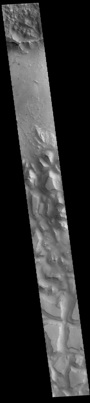 This VIS image shows part of Hydraotes Chaos. Hydraotes Chaos measures about 300 kilometers (190 miles) wide by roughly 350 km (220 mi) north-south. The chaos lies in a valley leading northeast out of Ganges Chasma at the east end of Valles Marineris. Tiu Valles flows northward from Hydraotes Chaos to empty into Chryse Planitia. In planetary nomenclature, the descriptor term chaos means "distinctive area of broken terrain". The general morphology of chaos is steep-sided mesas in close proximity. With time and erosion the valleys widen and the mesas grow smaller. The initial breakup of the land can be due to tectonic forces, but on Mars it is thought that the release of melted, subsurface ice created the terrain. Large channels, like Tiu Valles, usually originate from regions of chaos.  Orbit Number: 86003 Latitude: 2.07857 Longitude: 324.563 Instrument: VIS Captured: 2021-05-04 19:05  https://photojournal.jpl.nasa.gov/catalog/PIA24219
