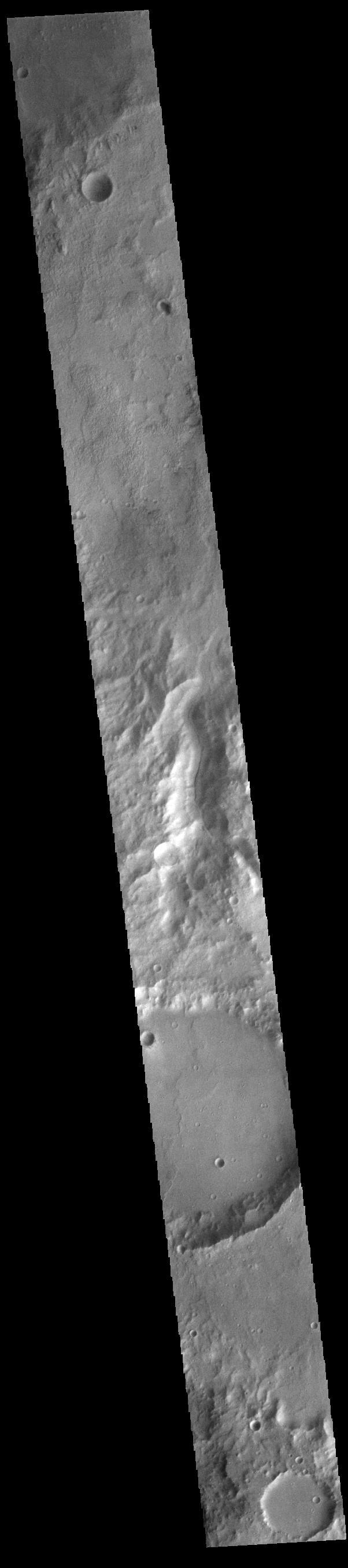 Today's VIS image shows an unnamed channel located on the northern boundary of Terra Sirenum near Lucus Planum.  Orbit Number: 83225 Latitude: -12.1131 Longitude: 187.493 Instrument: VIS Captured: 2020-09-18 01:25  https://photojournal.jpl.nasa.gov/catalog/PIA24243