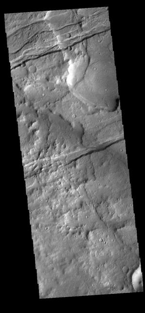 The linear depressions in this VIS image are part of Sirenum Fossae. These depressions are called graben, which form by the down drop of material between two parallel faults. The faults are caused by tectonic stresses in the region. The Sirenum Fossae graben are 2735km (1700 miles) long. Orbit Number: 83262 Latitude: -33.4902 Longitude: 203.133 Instrument: VIS Captured: 2020-09-21 02:25 https://photojournal.jpl.nasa.gov/catalog/PIA24246