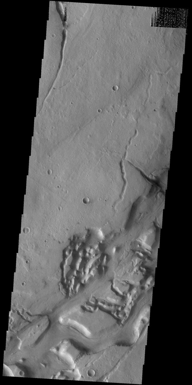 This VIS image shows a portion of Niger Vallis. The channel is 333 km (207 miles) long. Arising from the volcano Hadriacus Mons, Niger Vallis merges with Dao Vallis and flows southwestward into Hellas Planitia. The channel is named for the Niger Rivier in Africa.  Orbit Number: 83734 Latitude: -36.231 Longitude: 90.9557 Instrument: VIS Captured: 2020-10-29 22:33  https://photojournal.jpl.nasa.gov/catalog/PIA24279