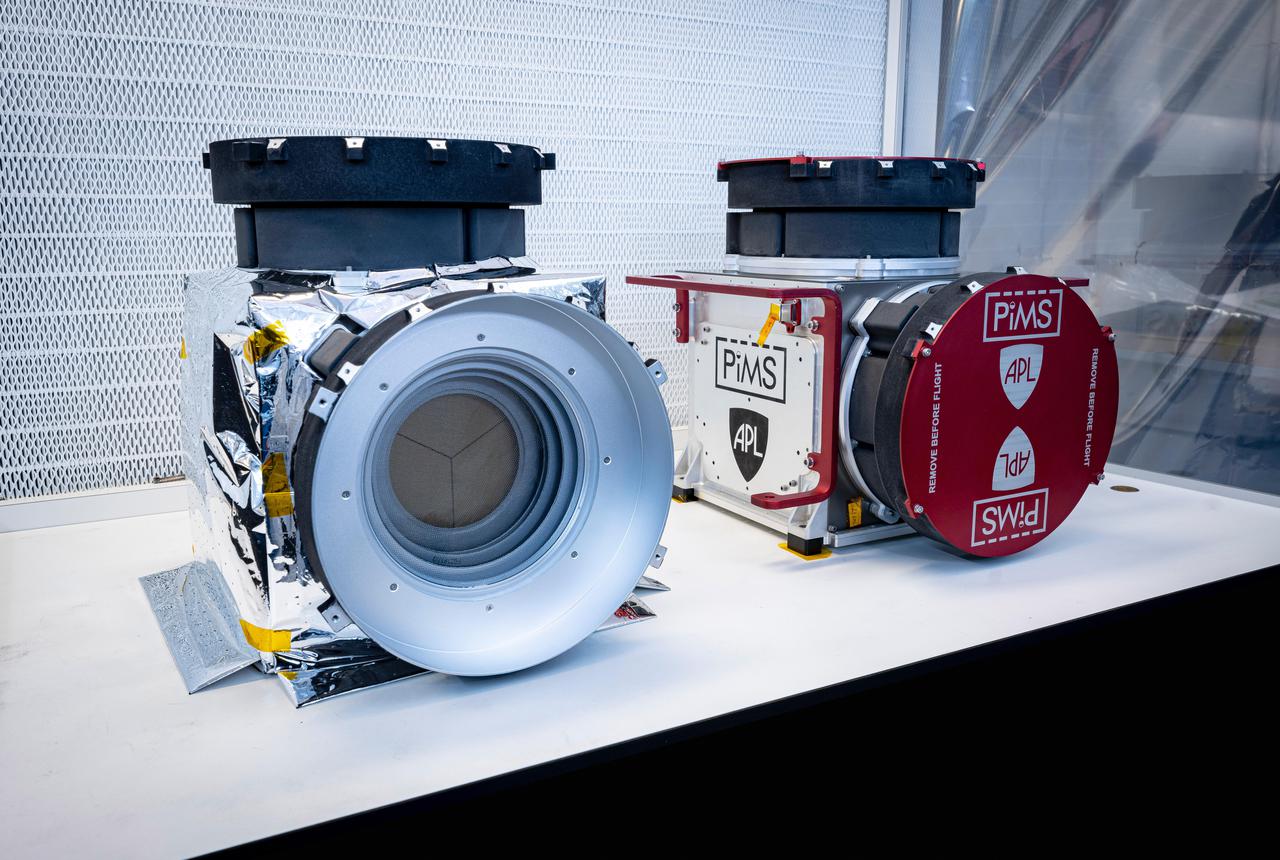 Included in the payload of science instruments for NASA's Europa Clipper is the Plasma Instrument for Magnetic Sounding (PIMS). Scientists will use PIMS to study the characteristics of plasma around Europa to better understand the moon's ice shell thickness, ocean depth, and ocean salinity.  Built by the Johns Hopkins Applied Physics Laboratory (APL) in Laurel, Maryland, PIMS is made up of two instruments, each with two identical sensors called Faraday cups that will measure the plasmas, or electrically charged gases, in Europa's ionosphere and Jupiter's magnetosphere.  Pictured in a clean room at APL are the recently assembled Faraday cup sensors and instrument housings in two configurations. On the left is the final flight hardware, with insulating thermal blankets installed; on the right is a test configuration that protects sensitive hardware for transportation.  With an internal global ocean twice the size of Earth's oceans combined, Europa may have the potential to harbor life. NASA's Europa Clipper spacecraft will swoop around Jupiter on an elliptical path, dipping close to the moon on each flyby to collect data. Understanding Europa's habitability will help scientists better understand how life developed on Earth and the potential for finding life beyond our planet.  https://photojournal.jpl.nasa.gov/catalog/PIA24327