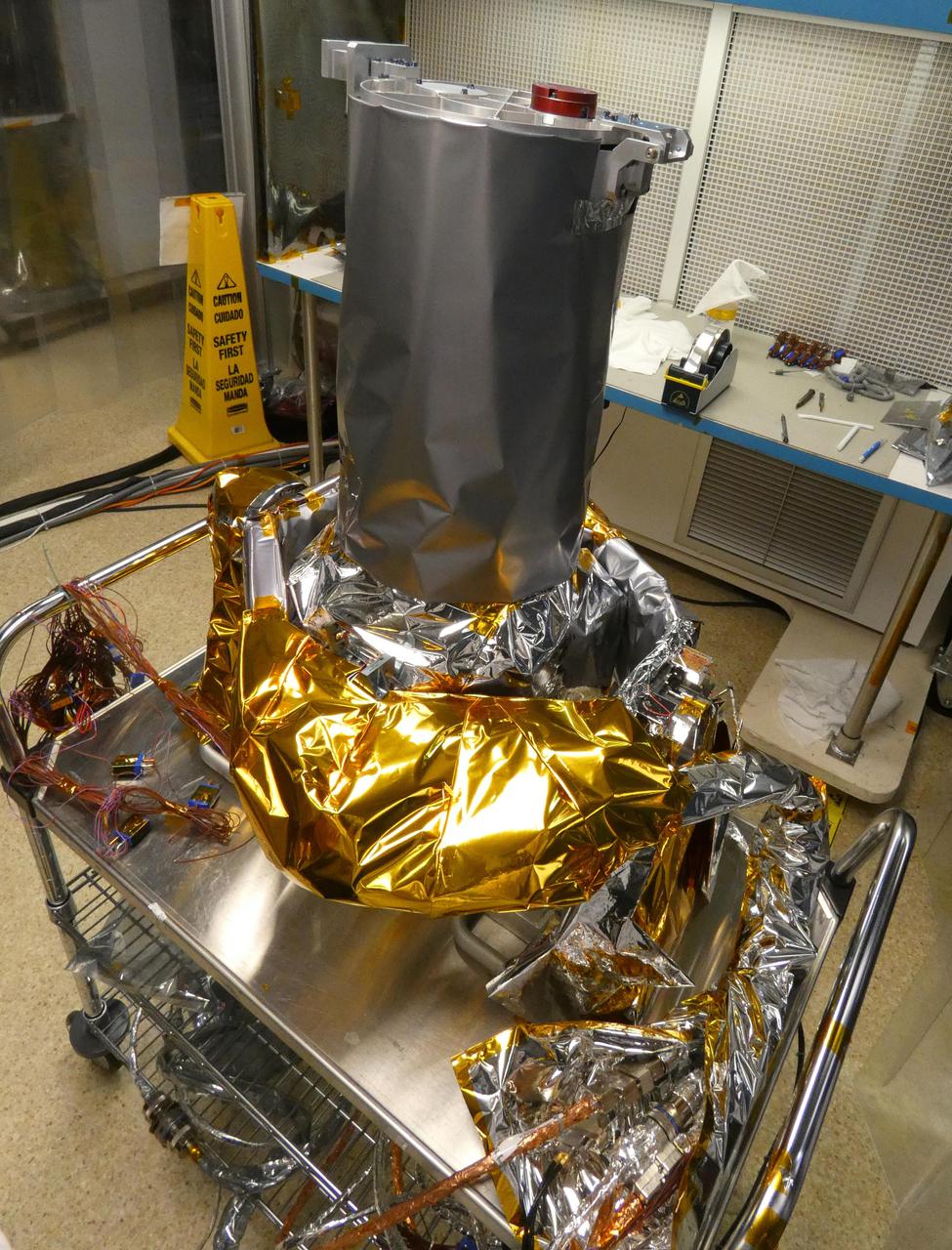 Included in the payload of science instruments for NASA's Europa Clipper is the Europa Imaging System (EIS) Narrow Angle Camera (NAC). Shown here at the Johns Hopkins Applied Physics Laboratory (APL) in Laurel, Maryland, the engineering model, which is used to test the instrument, is mounted on the two-axis gimbal mechanism that allows the NAC telescope to be pointed independently. The model consists of the NAC telescope, electronics, gimbal, and cables, covered in thermal blankets.  EIS will allow groundbreaking measurements and map most of Europa, an icy moon of Jupiter with an ocean under its crust, at resolutions previous missions could only achieve in small areas. EIS data will offer fresh insights into Europa's geological structure and processes and will be used to search for evidence of recent or current geologic activity, including potential erupting plumes.  With an internal global ocean twice the size of Earth's oceans combined, Europa may have the potential to harbor life. NASA's Europa Clipper spacecraft will swoop around Jupiter on an elliptical path, dipping close to the moon on each flyby to collect data. Understanding Europa's habitability will help scientists better understand how life developed on Earth and the potential for finding life beyond our planet.  https://photojournal.jpl.nasa.gov/catalog/PIA24328
