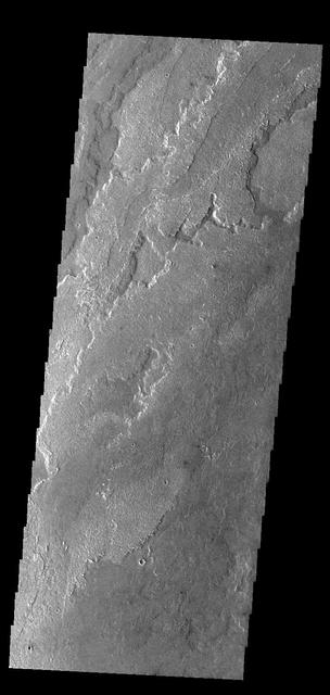 Today's VIS image shows a small portion of the immense lava flows that originated from Arsia Mons. Arsia Mons is the southernmost of the three large aligned volcanoes in the Tharsis region. Arsia Mons' last eruption was 10s of million years ago. The different surface textures are created by differences in the lava viscosity and cooling rates. The lobate margins of each flow can be traced back to the start of each flow — or to the point where they are covered by younger flows. Flows in Daedalia Planum can be as long as 180 km.  Orbit Number: 84066 Latitude: -22.1783 Longitude: 235.511 Instrument: VIS Captured: 2020-11-26 06:32  https://photojournal.jpl.nasa.gov/catalog/PIA24367