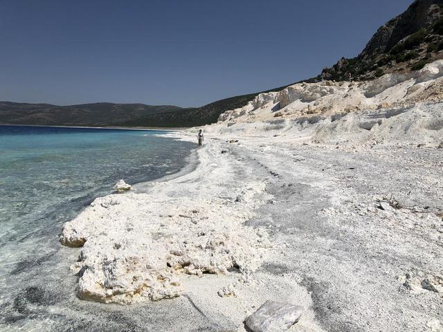 The eastern shore of Lake Salda in Turkey is a good analog for what an ancient lake may have looked like at Jezero Carter on Mars. The white sands and rocks are carbonate minerals that precipitated in the lake. The terraces on the right are old shorelines from when the lake levels were higher, where dried-out sediments have now cemented. These types of deposits might be present along the former shorelines at Jezero. What's more, these deposits might contain signs of microbes, if they ever existed on the Red Planet. NASA's Mars 2020 Perseverance mission will search for signs of ancient life in an dried-up lakebed on the surface of Mars. https://photojournal.jpl.nasa.gov/catalog/PIA24375