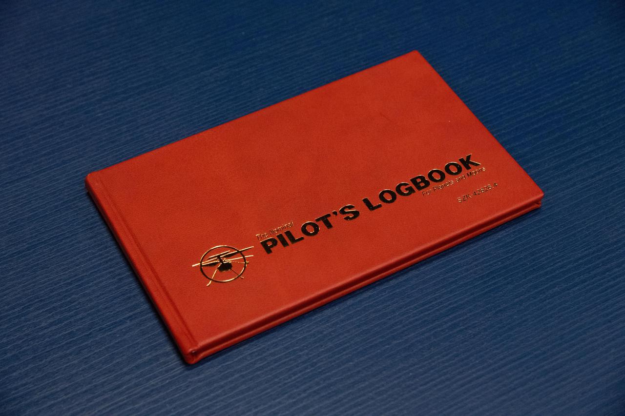 This image of the official pilot's logbook for the Ingenuity Mars Helicopter flights — the "Nominal Pilot's Logbook for Planets and Moons" — was taken at NASA's Jet Propulsion Laboratory in Southern California on April 19, 2021, the day of Ingenuity's first historic flight. Pilot logbooks are used by aviators to provide a record of their flights, including current and accumulated flight time, number and locations of takeoffs and landings, as well as unique operating conditions and certifications.  https://photojournal.jpl.nasa.gov/catalog/PIA24440