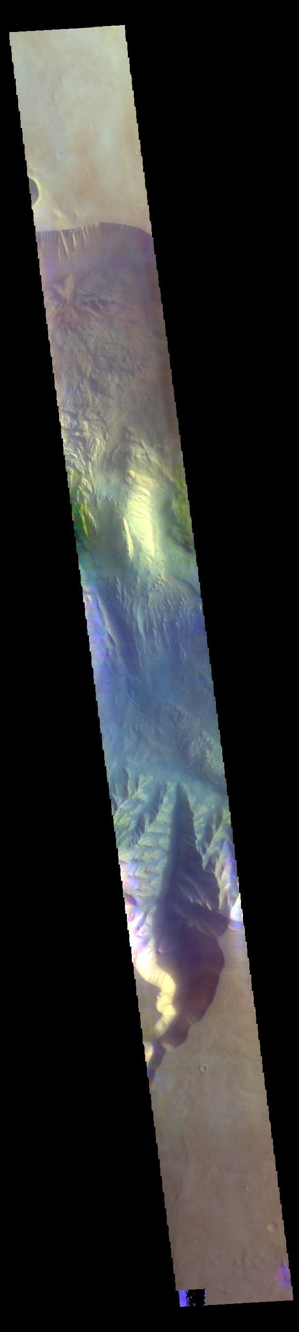 The THEMIS VIS camera contains 5 filters. The data from different filters can be combined in multiple ways to create a false color image. These false color images may reveal subtle variations of the surface not easily identified in a single band image. Today's false color image shows a cross section of Hebes Chasma. Hebes Chasma is a closed basin located north of Valles Marineris. It measures 126km wide north/south (78 miles), 315 km long east/west (196 miles), and 8 km (5 miles) at its deepest point.  Orbit Number: 69810 Latitude: -1.17427 Longitude: 284.446 Instrument: VIS Captured: 2017-09-09 05:33  https://photojournal.jpl.nasa.gov/catalog/PIA24455