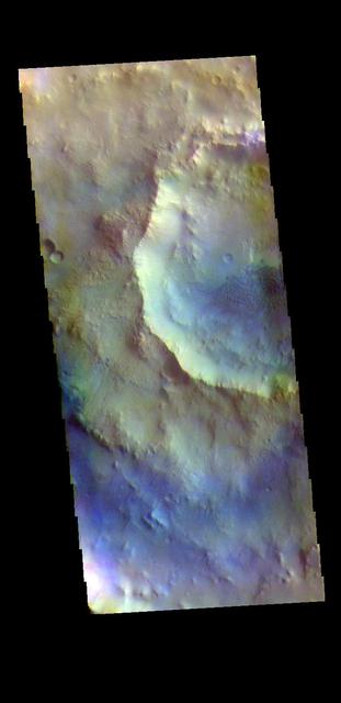 The THEMIS VIS camera contains 5 filters. The data from different filters can be combined in multiple ways to create a false color image. These false color images may reveal subtle variations of the surface not easily identified in a single band image. Today's false color image shows two craters, one inside the other. These unnamed craters are located in Arabia Terra. Dunes are visible on the floor of the inner crater. Orbit Number: 70157 Latitude: 6.47569 Longitude: 346.696 Instrument: VIS Captured: 2017-10-07 19:45 https://photojournal.jpl.nasa.gov/catalog/PIA24501