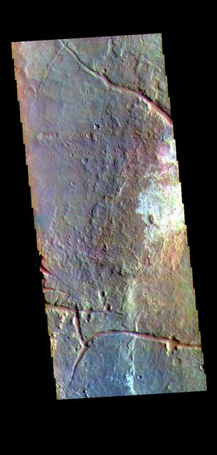 The THEMIS VIS camera contains 5 filters. The data from different filters can be combined in multiple ways to create a false color image. These false color images may reveal subtle variations of the surface not easily identified in a single band image. Today's false color image shows part of Margaritifer Terra. The linear depressions were created by extensional tectonic stresses. The nature of the white toned material is unknown at this time.  Orbit Number: 71991 Latitude: -18.9301 Longitude: 332.049 Instrument: VIS Captured: 2018-03-07 21:50  https://photojournal.jpl.nasa.gov/catalog/PIA24515