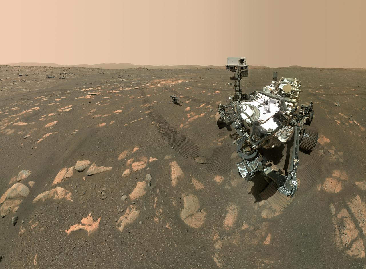 NASA's Perseverance Mars rover took a selfie with the Ingenuity helicopter, seen here about 13 feet (3.9 meters) from the rover in this image taken April 6, 2021, the 46th Martian day, or sol, of the mission by the WATSON (Wide Angle Topographic Sensor for Operations and eNgineering) camera on the SHERLOC (Scanning Habitable Environments with Raman and Luminescence for Organics and Chemicals) instrument, located at the end of the rover's long robotic arm.  Perseverance's selfie with Ingenuity is made up of 62 individual images stitched together once they are sent back to Earth; they were taken in sequence while the rover was looking at the helicopter, then again while it was looking at the WATSON camera. The Curiosity rover takes similar selfies using a camera on its robotic arm.  Movie available at https://photojournal.jpl.nasa.gov/catalog/PIA24542