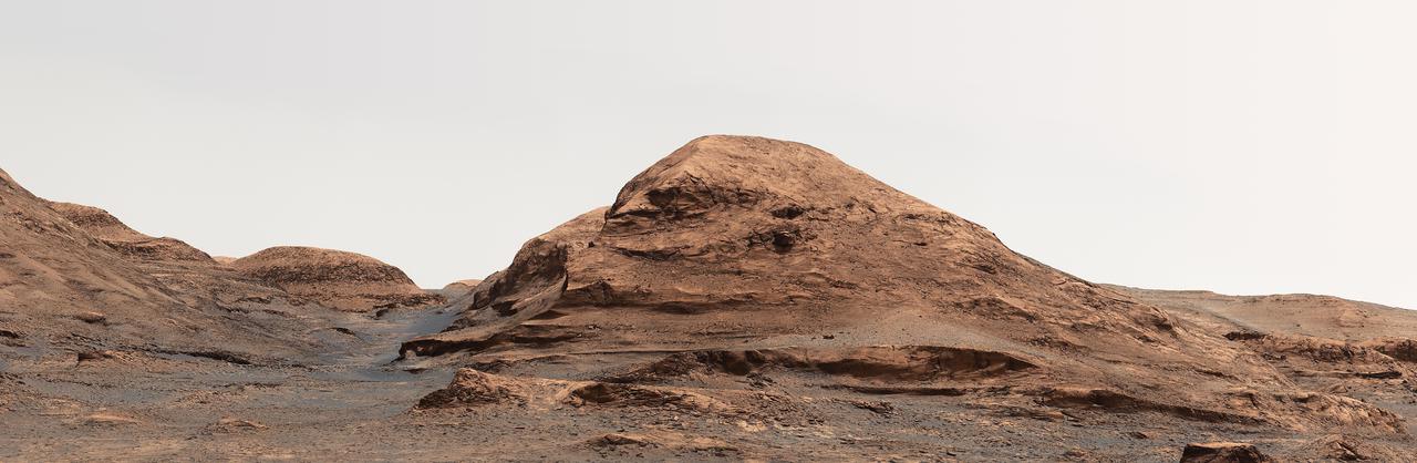 NASA's Curiosity Mars rover used its Mastcam to take an image of this hill, nicknamed "Rafael Navarro Mountain" after Rafael Navarro-González, an astrobiologist who worked on the mission until he passed away January 26, 2021. He was a member of the team working with Curiosity's Sample Analysis at Mars, or SAM, instrument.  https://photojournal.jpl.nasa.gov/catalog/PIA24544