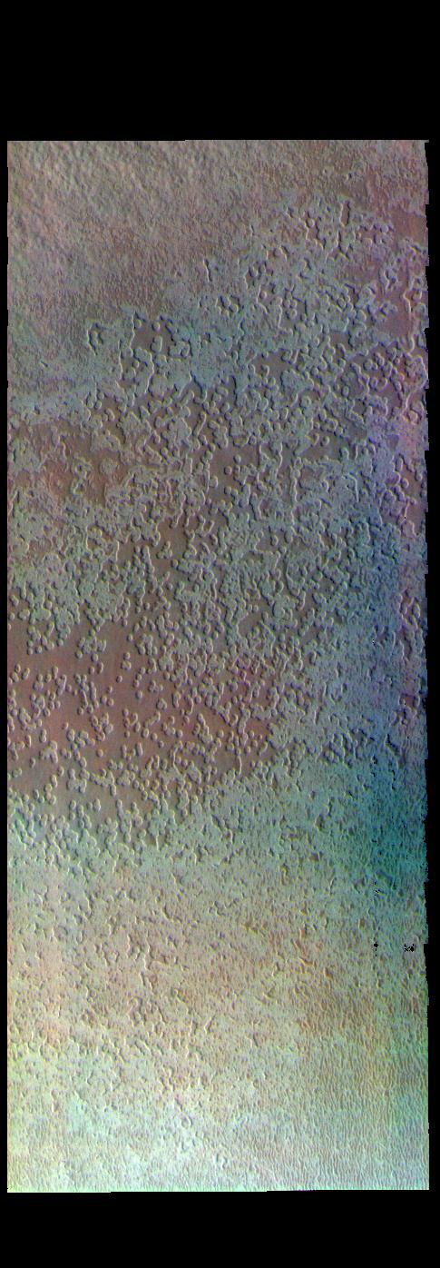 The THEMIS VIS camera contains 5 filters. The data from different filters can be combined in multiple ways to create a false color image. These false color images may reveal subtle variations of the surface not easily identified in a single band image. Today's false color image shows part of Australe Mensa, part of the south polar ice cap. The round depressions have given rise to the informal name Swiss cheese. The depressions are seen only in the top layer of the ice.  Orbit Number: 73802 Latitude: -86.9527 Longitude: 353.712 Instrument: VIS Captured: 2018-08-04 01:51  https://photojournal.jpl.nasa.gov/catalog/PIA24556