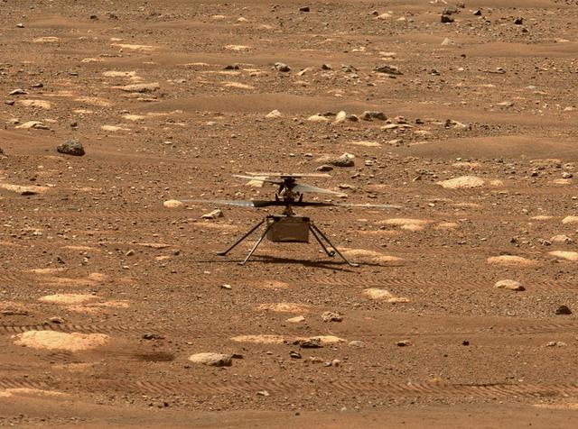 NASA's Ingenuity helicopter unlocked its rotor blades, allowing them to spin freely, on April 7, 2021, the 47th Martian day, or sol, of the mission. They had been held in place since before launch, and the unlocking is one of several milestones that must be met before the helicopter can attempt the first powered, controlled flight on another planet. This image was captured by the Mastcam-Z imager on NASA's Perseverance Mars rover on the following sol, April 8, 2021. The Ingenuity Mars Helicopter was built by JPL, which also manages this technology demonstration project for NASA Headquarters. It is supported by NASA's Science Mission Directorate, Aeronautics Research Mission Directorate, and Space Technology Mission Directorate. NASA's Ames Research Center and Langley Research Center provided significant flight performance analysis and technical assistance during Ingenuity's development. A key objective for Perseverance's mission on Mars is astrobiology, including the search for signs of ancient microbial life. The rover will characterize the planet's geology and past climate, pave the way for human exploration of the Red Planet, and be the first mission to collect and cache Martian rock and regolith (broken rock and dust). Subsequent NASA missions, in cooperation with ESA (European Space Agency), would send spacecraft to Mars to collect these sealed samples from the surface and return them to Earth for in-depth analysis. The Mars 2020 Perseverance mission is part of NASA's Moon to Mars exploration approach, which includes Artemis missions to the Moon that will help prepare for human exploration of the Red Planet. https://photojournal.jpl.nasa.gov/catalog/PIA24581