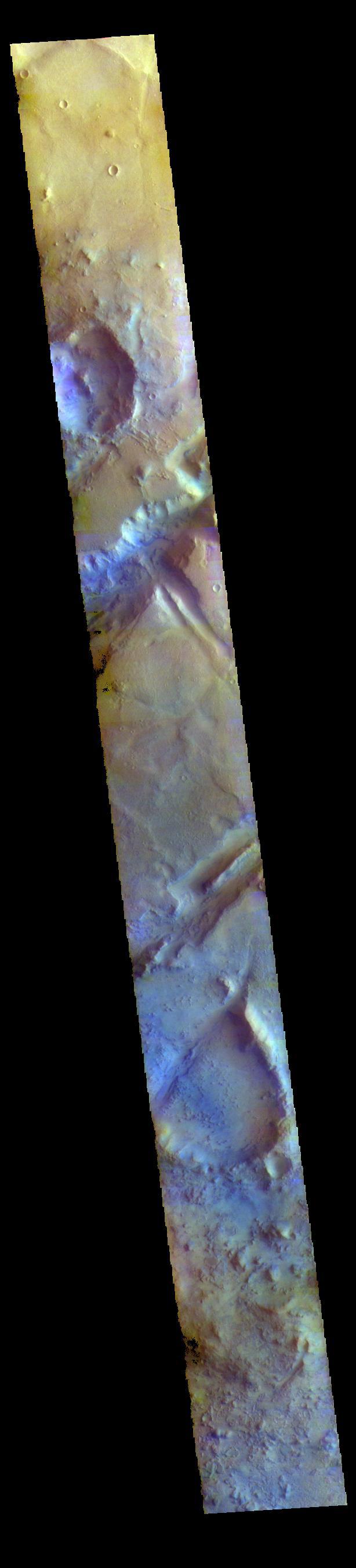 The THEMIS VIS camera contains 5 filters. The data from different filters can be combined in multiple ways to create a false color image. These false color images may reveal subtle variations of the surface not easily identified in a single band image. Today's false color image shows part of Nili Fossae. Nili Fossae is a collection of curved faults and down-dropped blocks of crust between the faults called graben. The graben lie northeast of the large volcano Syrtis Major and northwest of the ancient impact basin Isidis Planitia. The graben are concentric to the Isidis impact basin and extend for 727km (452 miles).  Orbit Number: 77264 Latitude: 22.4987 Longitude: 78.2175 Instrument: VIS Captured: 2019-05-16 05:27  https://photojournal.jpl.nasa.gov/catalog/PIA24607