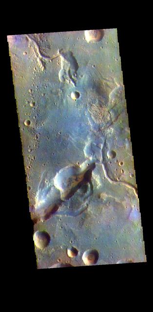 The THEMIS VIS camera contains 5 filters. The data from different filters can be combined in multiple ways to create a false color image. These false color images may reveal subtle variations of the surface not easily identified in a single band image. Today's false color image shows the northern margin of Arabia Terra. Numerous unnamed channels dissect this region of Arabia Terra, flowing downward into Acidalia Planitia. Orbit Number: 77367 Latitude: 31.0987 Longitude: 345.16 Instrument: VIS Captured: 2019-05-24 17:05 https://photojournal.jpl.nasa.gov/catalog/PIA24610