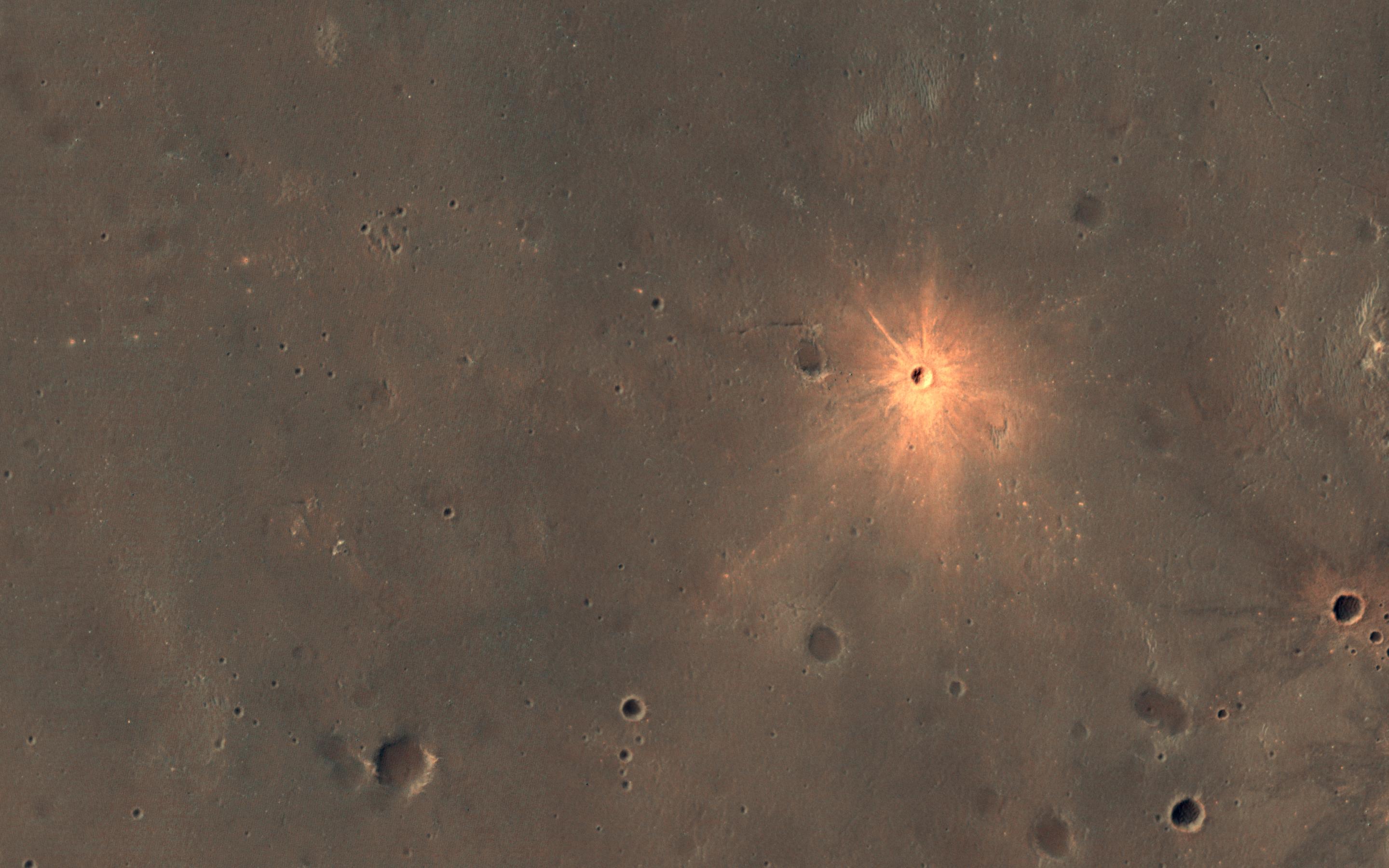 A New Impact Crater with Bright Ejecta