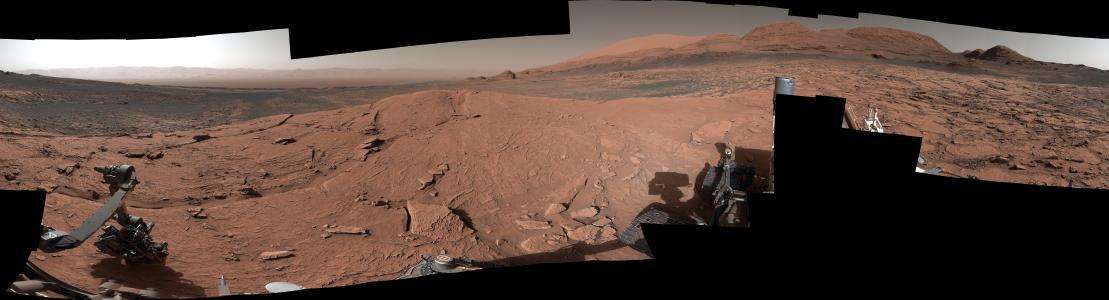 NASA's Curiosity Mars rover took this 360-degree panorama while atop "Mont Mercou," a rock formation that offered a view into Gale Crater below. The panorama is stitched together from 132 individual images taken on April 15, 2021, the 3,090th Martian day, or sol, of the mission. The panorama has been white-balanced so that the colors of the rock materials resemble how they would appear under daytime lighting conditions on Earth.  https://photojournal.jpl.nasa.gov/catalog/PIA24626