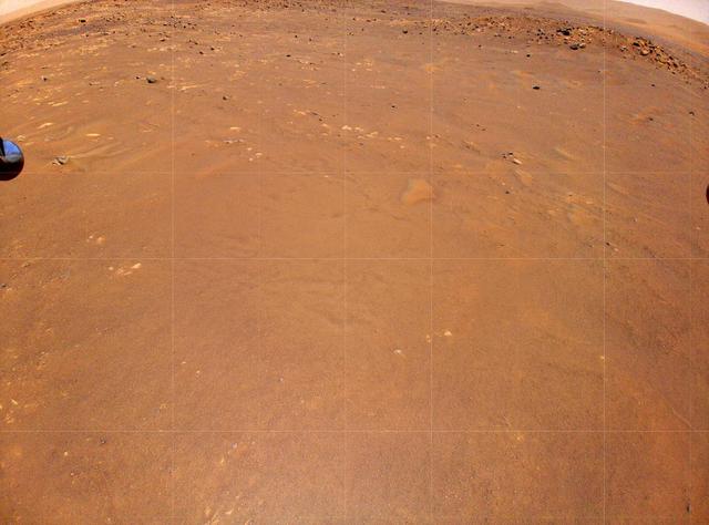 NASA's Ingenuity Mars Helicopter took this color image during its fourth flight, on April 30, 2021. "Airfield B," its new landing site, can be seen below. The helicopter will seek to set down there on its fifth flight attempt. An unannotated version of the image has also been provided.  https://photojournal.jpl.nasa.gov/catalog/PIA24628