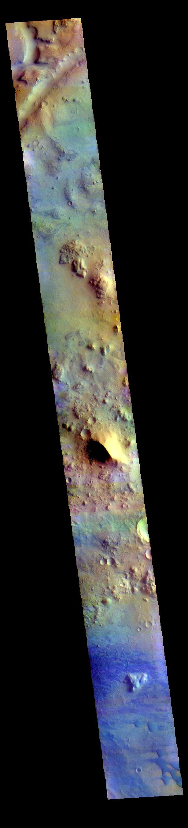 The THEMIS VIS camera contains 5 filters. The data from different filters can be combined in multiple ways to create a false color image. These false color images may reveal subtle variations of the surface not easily identified in a single band image. Today's false color image shows part of Terra Sabaea between the graben of Nili Fossae (depression at the top of the image) and the lowlands of Isidis Planitia. Small sand dunes are visible near the bottom of the image. Dark blue tones in this filter combination indicate basaltic sands.  Orbit Number: 78075 Latitude: 21.3155 Longitude: 79.0343 Instrument: VIS Captured: 2019-07-22 00:17  https://photojournal.jpl.nasa.gov/catalog/PIA24640