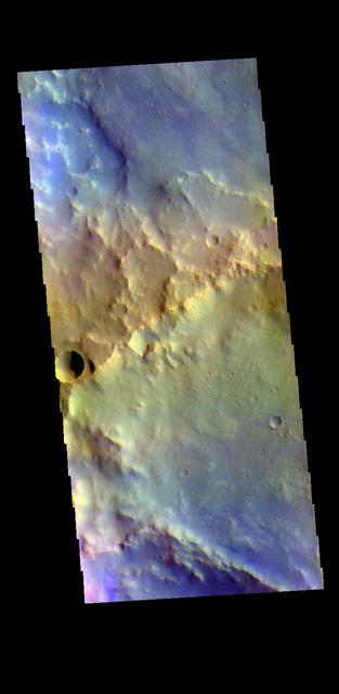 The THEMIS VIS camera contains 5 filters. The data from different filters can be combined in multiple ways to create a false color image. These false color images may reveal subtle variations of the surface not easily identified in a single band image. Today's false color image shows part of two unnamed craters in Arabia Terra. Orbit Number: 78902 Latitude: 21.9937 Longitude: 338.788 Instrument: VIS Captured: 2019-09-28 02:42 https://photojournal.jpl.nasa.gov/catalog/PIA24654