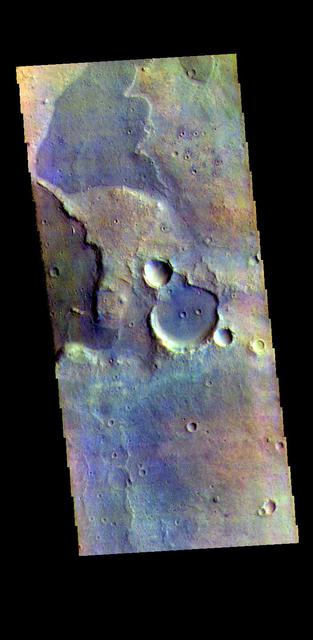 The THEMIS VIS camera contains 5 filters. The data from different filters can be combined in multiple ways to create a false color image. These false color images may reveal subtle variations of the surface not easily identified in a single band image. Today's false color image shows part of the plains of Arabia Terra. Orbit Number: 78977 Latitude: 17.9566 Longitude: 335.501 Instrument: VIS Captured: 2019-10-04 06:54 https://photojournal.jpl.nasa.gov/catalog/PIA24655